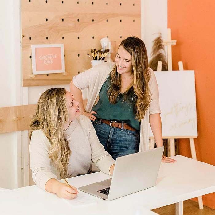 two girls creating and selling digital products