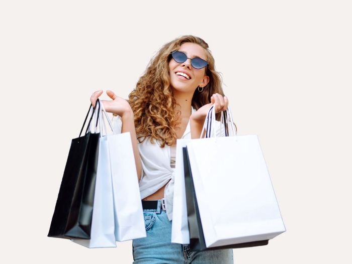 How to Make a Background Transparent in Canva (Step-by-Step Guide!) 4 Woman holding shopping bags, casual style. Image after removing the background