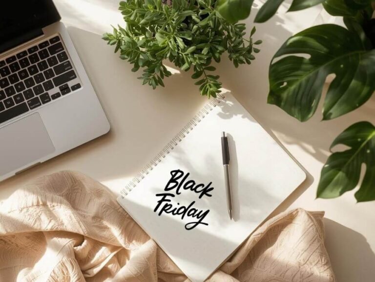 Laptop and notebook with Black Friday written on it